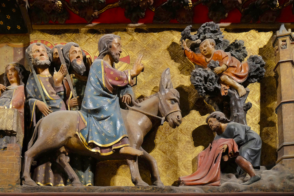PARIS, FRANCE - JANUARY 04: Intricately carved and painted frieze inside Notre Dame Cathedral depicting Jesus' triumphal entry into Jerusalem, Palm Sunday, UNESCO World Heritage Site in Paris, France on January 04, 2018. Pasen Notre-Dame